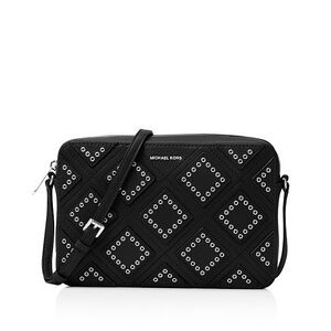 Michael Kors Jet Set Silver Grommet purse. EUC.